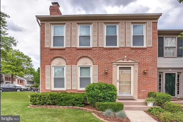 1 Second Tee Ct, Baltimore, MD 21209 - multi unit property with a chimney, brick siding, and a front yard