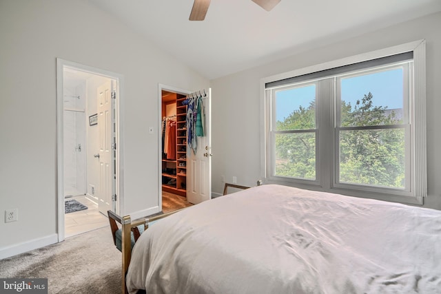 1 Second Tee Ct, Baltimore, MD 21209 - bedroom with a walk in closet, vaulted ceiling, carpet, a closet, and ensuite bath