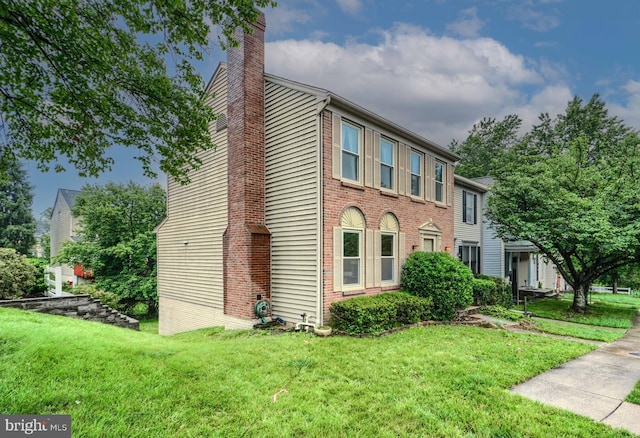 1 Second Tee Ct, Baltimore, MD 21209 - view of front of property featuring a chimney, a front lawn, and brick siding