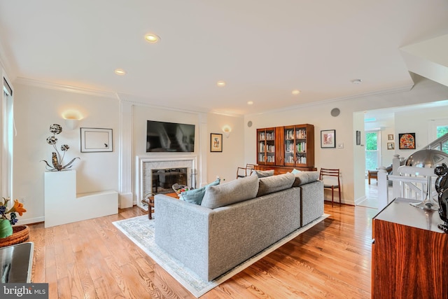 1 Second Tee Ct, Baltimore, MD 21209 - living area featuring ornamental molding, a fireplace, light wood-style floors, and recessed lighting