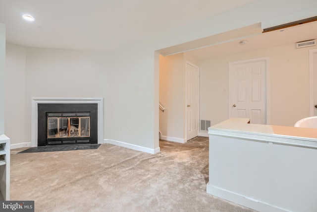 1 Second Tee Ct, Baltimore, MD 21209 - unfurnished living room featuring carpet flooring, a fireplace with flush hearth, and recessed lighting