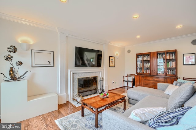 1 Second Tee Ct, Baltimore, MD 21209 - living area featuring ornamental molding, light wood-style floors, a glass covered fireplace, and recessed lighting