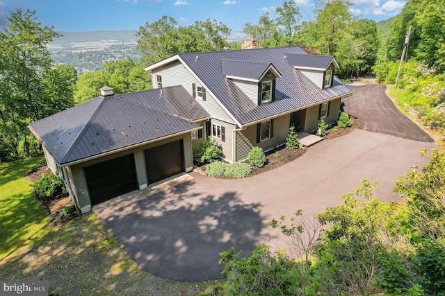 400 Berry Mountain Rd, Millersburg, PA 17061 - view of front facade with a chimney, driveway, metal roof, and a wooded view