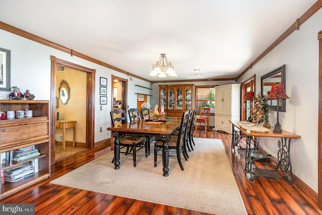 400 Berry Mountain Rd, Millersburg, PA 17061 - dining area with crown molding, a chandelier, wood finished floors, and baseboards