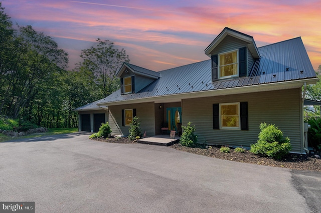 400 Berry Mountain Rd, Millersburg, PA 17061 - view of front facade featuring covered porch, metal roof, and an attached garage