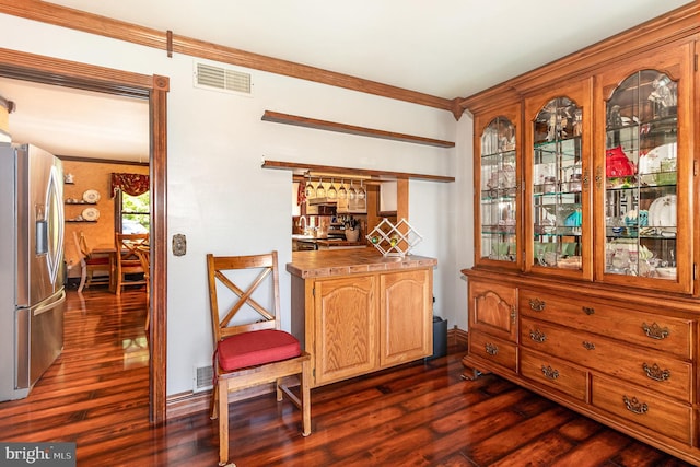 400 Berry Mountain Rd, Millersburg, PA 17061 - dining space featuring dark wood-style flooring, a bar, and ornamental molding