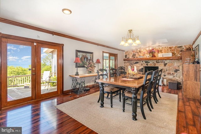 400 Berry Mountain Rd, Millersburg, PA 17061 - dining area with a chandelier, ornamental molding, wood-type flooring, french doors, and a fireplace