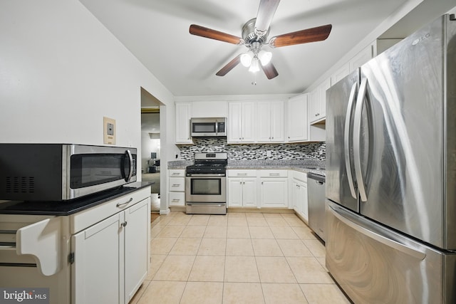 4408 Island Pl Unit T2, Annandale, VA 22003 - kitchen with stainless steel appliances, tasteful backsplash, light tile patterned floors, a ceiling fan, and white cabinetry