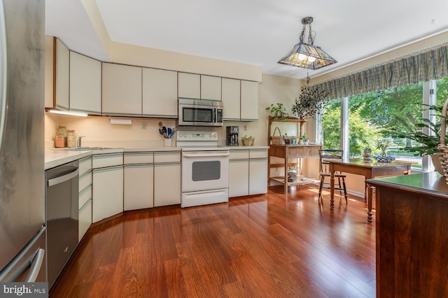 303 Knoll Way, Rocky Hill, NJ 08553 - kitchen with stainless steel appliances, light countertops, dark wood-style flooring, and white cabinetry