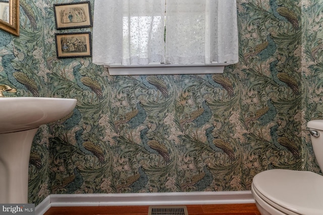 303 Knoll Way, Rocky Hill, NJ 08553 - half bathroom with wallpapered walls, baseboards, toilet, and wood finished floors