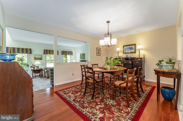 303 Knoll Way, Rocky Hill, NJ 08553 - dining area featuring wood finished floors, a chandelier, and baseboards
