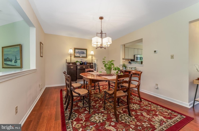 303 Knoll Way, Rocky Hill, NJ 08553 - dining space featuring wood finished floors, a chandelier, and baseboards