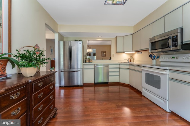 303 Knoll Way, Rocky Hill, NJ 08553 - kitchen with appliances with stainless steel finishes, dark wood-style flooring, light countertops, and dark brown cabinetry