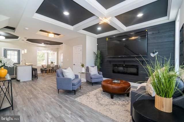 2817 Waldorf Ave, Baltimore, MD 21215 - living room with coffered ceiling, a glass covered fireplace, wood finished floors, ornamental molding, and beamed ceiling