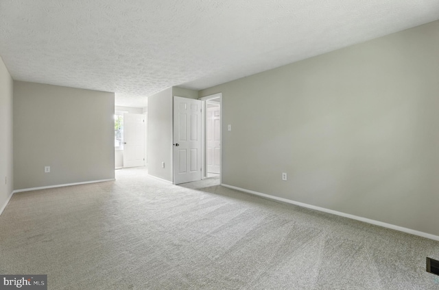 14612 Orangewood St, Silver Spring, MD 20905 - unfurnished room with carpet, baseboards, and a textured ceiling