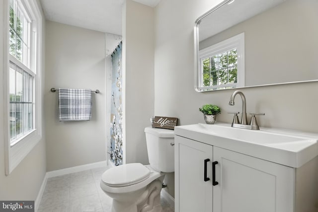 14612 Orangewood St, Silver Spring, MD 20905 - full bath with toilet, baseboards, vanity, tile patterned floors, and curtained shower