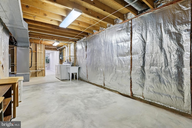 14612 Orangewood St, Silver Spring, MD 20905 - unfinished below grade area with washer and dryer and a sink