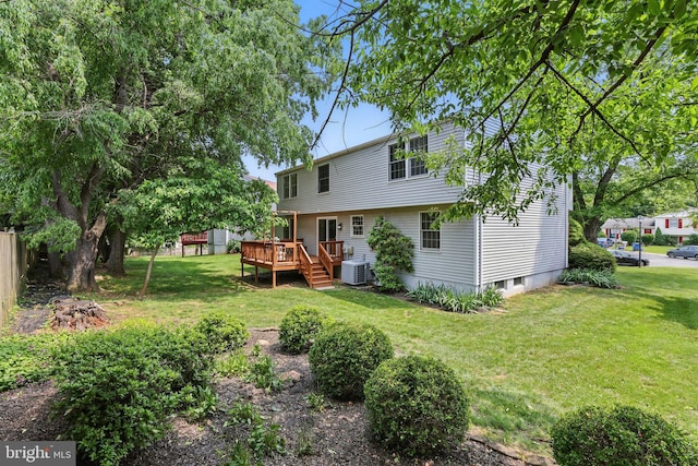 14612 Orangewood St, Silver Spring, MD 20905 - back of house with a wooden deck, a lawn, and central AC unit