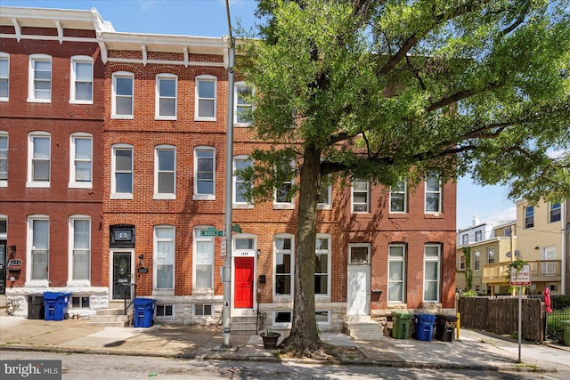 1630 E Biddle St, Baltimore, MD 21213 - townhome / multi-family property with entry steps and brick siding