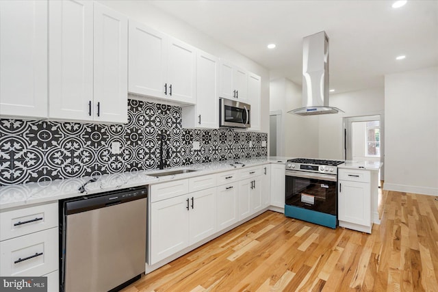 1630 E Biddle St, Baltimore, MD 21213 - kitchen featuring stainless steel appliances, island range hood, a sink, light countertops, and recessed lighting