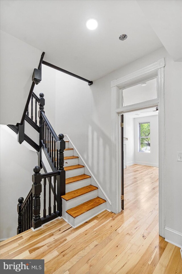1630 E Biddle St, Baltimore, MD 21213 - stairs featuring wood finished floors, baseboards, and recessed lighting