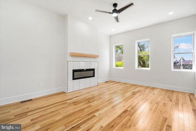 1630 E Biddle St, Baltimore, MD 21213 - unfurnished living room featuring wood-type flooring, a fireplace, a ceiling fan, baseboards, and recessed lighting