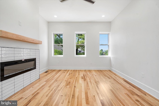 1630 E Biddle St, Baltimore, MD 21213 - unfurnished living room with a fireplace, wood-type flooring, baseboards, and recessed lighting