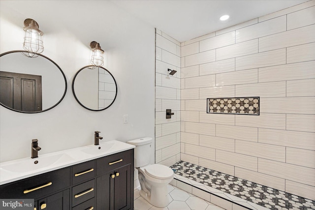 1630 E Biddle St, Baltimore, MD 21213 - full bath with double vanity, toilet, a tile shower, tile patterned flooring, and recessed lighting