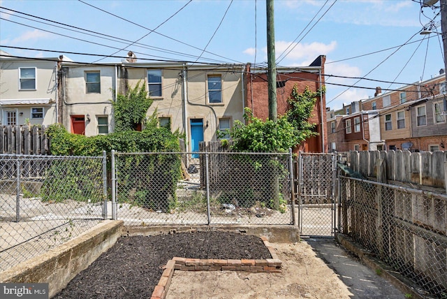 1630 E Biddle St, Baltimore, MD 21213 - view of front of house featuring a gate and a residential view