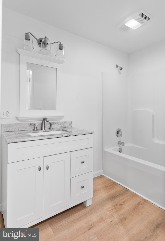 26959 Branchtown Rd, Worton, MD 21678 - bathroom with vanity, wood finished floors, and shower / bath combination