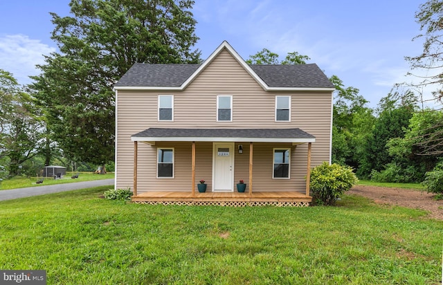 26959 Branchtown Rd, Worton, MD 21678 - traditional-style home with a front yard, covered porch, and roof with shingles