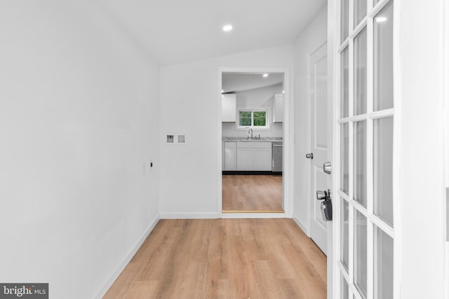 26959 Branchtown Rd, Worton, MD 21678 - hallway with light wood-type flooring, recessed lighting, french doors, vaulted ceiling, and a sink