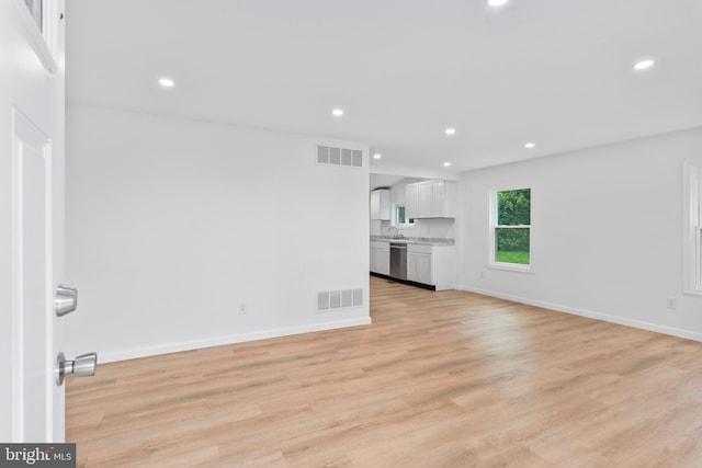 26959 Branchtown Rd, Worton, MD 21678 - unfurnished living room featuring recessed lighting, light wood finished floors, a sink, and baseboards