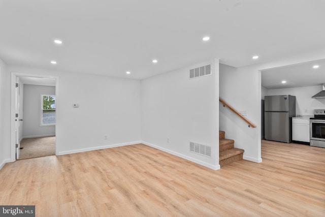 26959 Branchtown Rd, Worton, MD 21678 - unfurnished living room featuring recessed lighting, light wood-type flooring, stairs, and baseboards