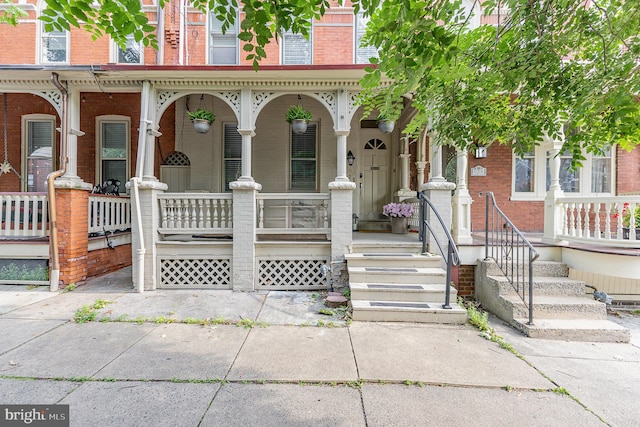 335 W Walnut St, Lancaster, PA 17603 - view of front of house with covered porch and brick siding