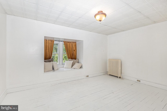 335 W Walnut St, Lancaster, PA 17603 - empty room featuring radiator heating unit, wood finished floors, and baseboards