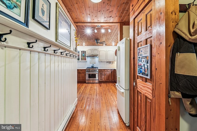 4441 Solomons Island Rd, Harwood, MD 20776 - kitchen featuring high end stainless steel range, freestanding refrigerator, wooden ceiling, light wood-type flooring, and backsplash