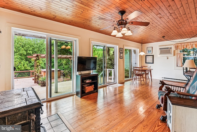 4441 Solomons Island Rd, Harwood, MD 20776 - living area with ceiling fan, a baseboard radiator, ornamental molding, a wall mounted air conditioner, and light wood finished floors