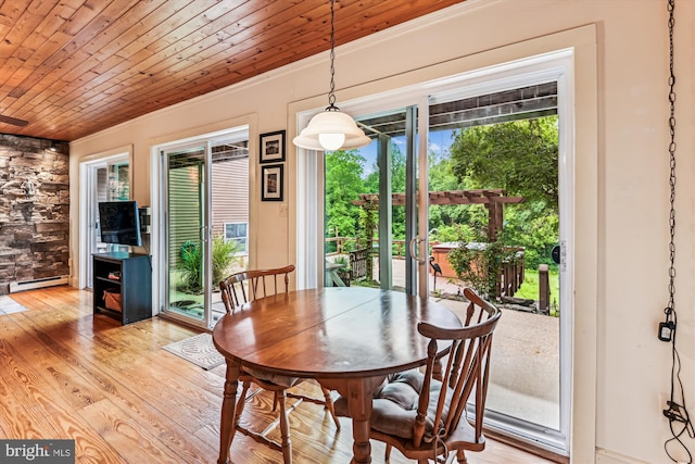 4441 Solomons Island Rd, Harwood, MD 20776 - dining area featuring baseboard heating, wood ceiling, light wood-type flooring, and crown molding