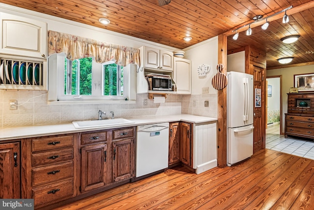 4441 Solomons Island Rd, Harwood, MD 20776 - kitchen with white appliances, light wood finished floors, wooden ceiling, track lighting, and light countertops