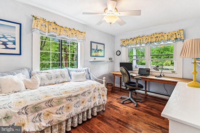 4441 Solomons Island Rd, Harwood, MD 20776 - bedroom with a baseboard radiator, wood finished floors, multiple windows, and a desk