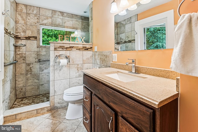 4441 Solomons Island Rd, Harwood, MD 20776 - full bathroom featuring vanity, a tile shower, tile patterned floors, and tile walls