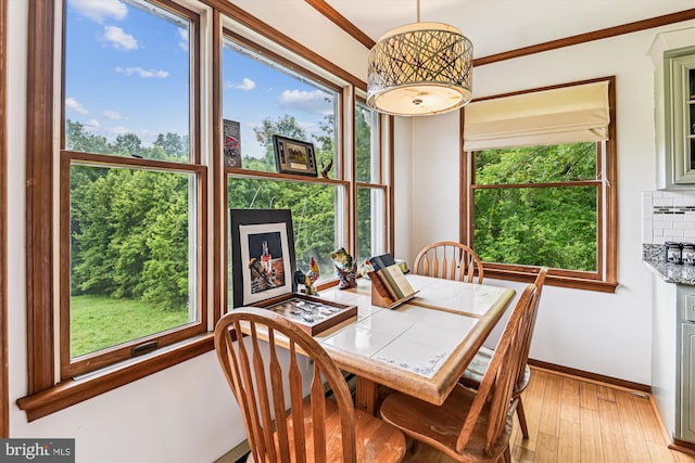 4441 Solomons Island Rd, Harwood, MD 20776 - dining room featuring light wood-style floors and crown molding