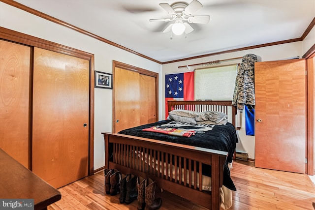 4441 Solomons Island Rd, Harwood, MD 20776 - bedroom with two closets, light wood-style flooring, ornamental molding, and ceiling fan