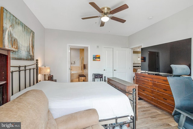 444 W Broad St Unit 401, Falls Church, VA 22046 - bedroom featuring wood finished floors, connected bathroom, and ceiling fan