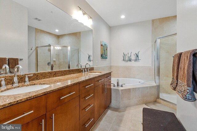 444 W Broad St Unit 401, Falls Church, VA 22046 - bathroom with tile patterned flooring, a stall shower, a garden tub, double vanity, and recessed lighting