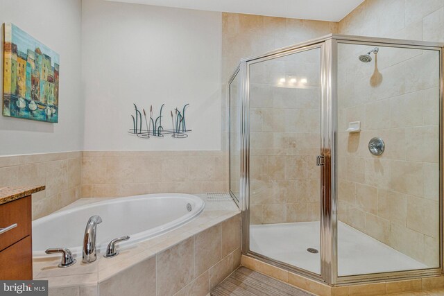 444 W Broad St Unit 401, Falls Church, VA 22046 - bathroom featuring a garden tub, a shower stall, and vanity