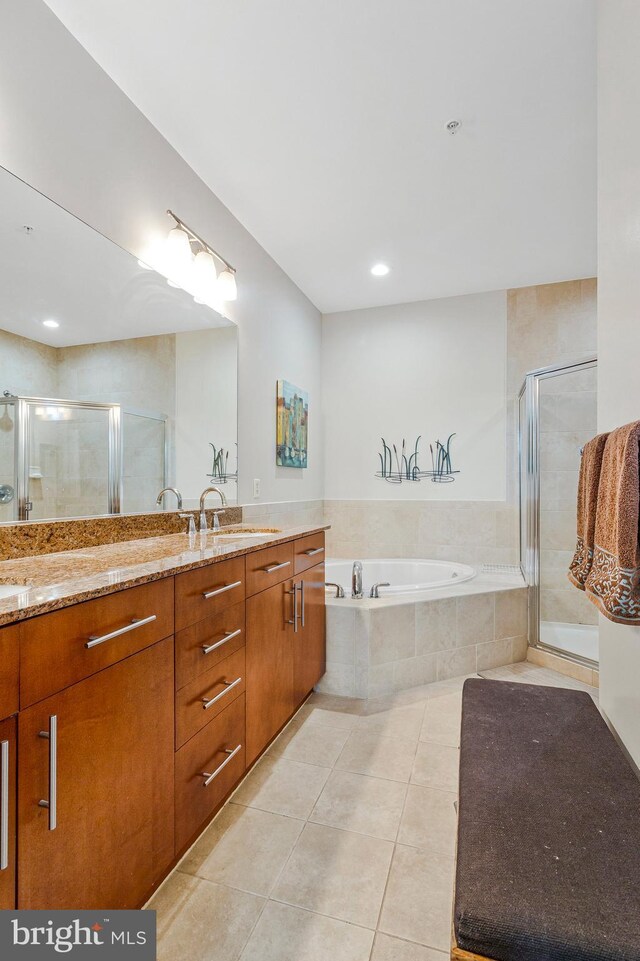 444 W Broad St Unit 401, Falls Church, VA 22046 - full bath featuring tile patterned flooring, double vanity, a bath, and a stall shower