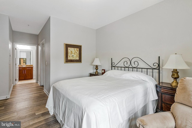 444 W Broad St Unit 401, Falls Church, VA 22046 - bedroom with wood finished floors and baseboards