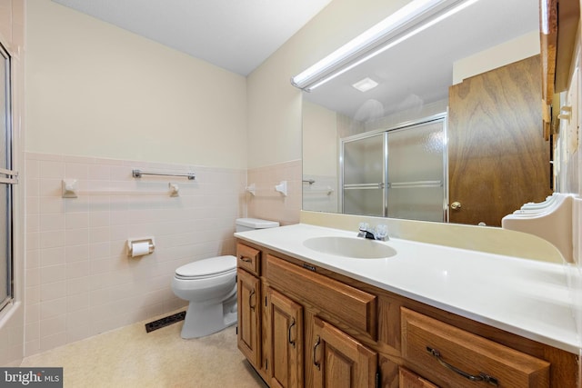 18 Old Whaling Ln, Long Beach Township, NJ 08008 - full bathroom with vanity, a shower with door, tile walls, and a wainscoted wall